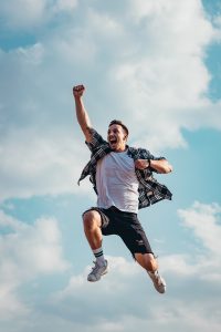 Man jumping for joy smelling clean and fresh