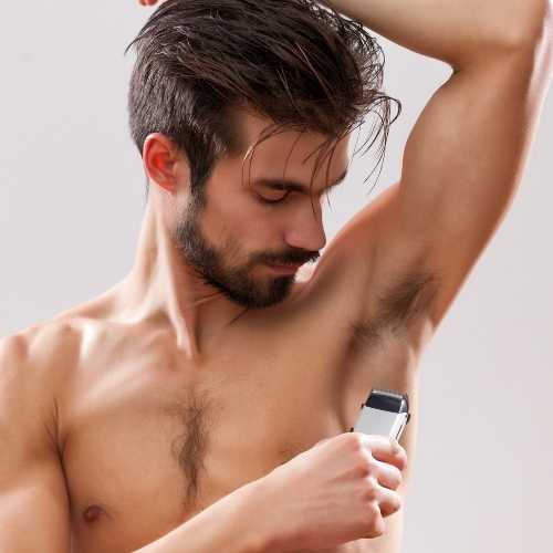 man shaving his armpits