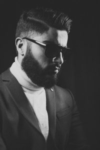 black and white picture with bearded man wearing sunglasses