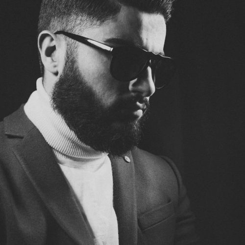 black and white picture with bearded man wearing sunglasses
